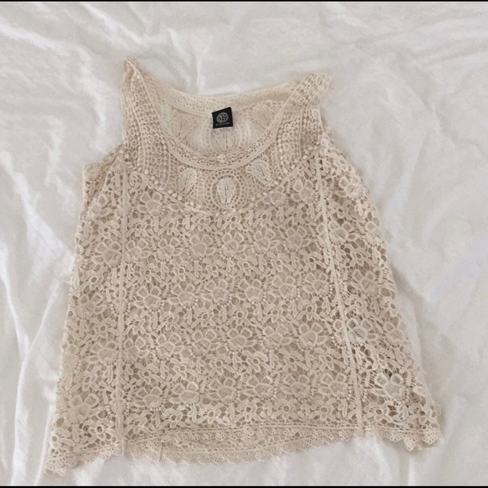 Cream colored Crochet lace overlay.